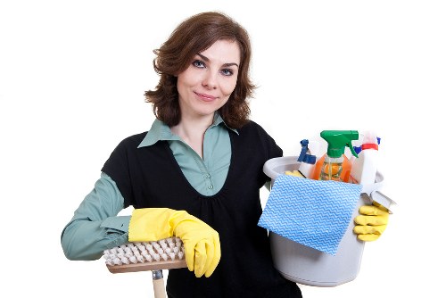Carpet cleaning team managing wet floor hazards and cables safely
